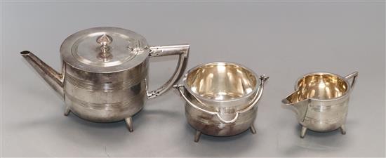 A three piece silver plated Walker and Hall tea set